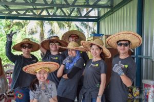 Volunteers pose for photo with sombrero hats