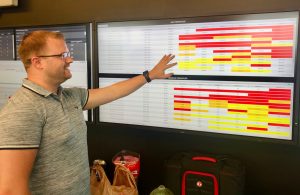 Houston Chatham takes a look at the screen showing call center wait times as Hurricane Florence approaches.