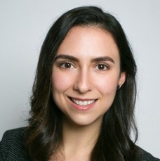 woman with black hair smiling