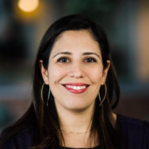 woman with black hair smiling