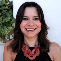 woman with black hair smiling