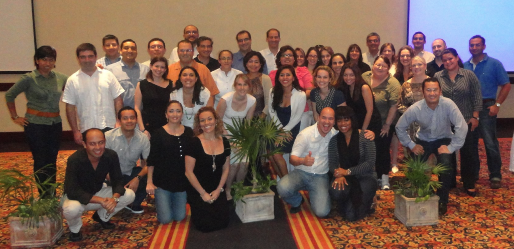 Adriana Segovia posing with large group of employees