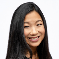 Woman with black hair smiling