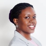 Woman with black hair in a bun smiling